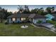 Single story home with attached garage and landscaped lawn at 813 Thornton Nw Ave, Port Charlotte, FL 33948