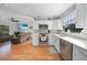 Modern kitchen with white cabinets, stainless steel appliances, and mosaic backsplash at 813 Thornton Nw Ave, Port Charlotte, FL 33948