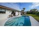 Stunning kidney-shaped pool with patio and backyard view at 813 Thornton Nw Ave, Port Charlotte, FL 33948