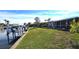 Spacious backyard with canal views and private dock at 1022 Lucia Dr, Punta Gorda, FL 33950