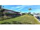 Landscaped backyard with canal views and fenced area at 1022 Lucia Dr, Punta Gorda, FL 33950