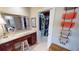 Bathroom features a vanity with granite countertop and a walk-in closet at 1022 Lucia Dr, Punta Gorda, FL 33950