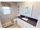 Clean bathroom with white vanity, subway tile, and new flooring at 1022 Lucia Dr, Punta Gorda, FL 33950