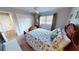 Guest bedroom with double doors and seashell bedding at 1022 Lucia Dr, Punta Gorda, FL 33950