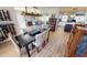 Open dining area with hardwood floors, a dark wood table, and views to the kitchen and living room at 1022 Lucia Dr, Punta Gorda, FL 33950