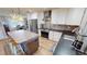 Modern kitchen with stainless steel appliances and an island at 1022 Lucia Dr, Punta Gorda, FL 33950