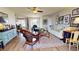 Bright and airy living room with hardwood floors, comfortable seating, and a view of the dining area at 1022 Lucia Dr, Punta Gorda, FL 33950