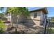 Fenced side yard with small garden area at 1022 Lucia Dr, Punta Gorda, FL 33950