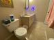 Bathroom with toilet and double vanity at 1051 Forrest Nelson Blvd # A-104, Port Charlotte, FL 33952