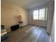 Bedroom with wood-look floors and closet at 1051 Forrest Nelson Blvd # A-104, Port Charlotte, FL 33952