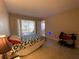 Bedroom with double bed and sliding door to patio at 1051 Forrest Nelson Blvd # A-104, Port Charlotte, FL 33952