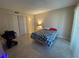 Bedroom with double bed and tile floors at 1051 Forrest Nelson Blvd # A-104, Port Charlotte, FL 33952