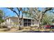 Two-story condo building with screened balconies and mature landscaping at 1051 Forrest Nelson Blvd # A-104, Port Charlotte, FL 33952
