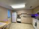 Small kitchen with white cabinets and a microwave at 1051 Forrest Nelson Blvd # A-104, Port Charlotte, FL 33952