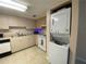 Stackable washer and dryer in a kitchen closet at 1051 Forrest Nelson Blvd # A-104, Port Charlotte, FL 33952
