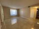 Bright living room with tile floors and large window at 1051 Forrest Nelson Blvd # A-104, Port Charlotte, FL 33952