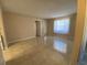 Bright living room with tile floors and access to other rooms at 1051 Forrest Nelson Blvd # A-104, Port Charlotte, FL 33952