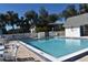 Inviting community pool with surrounding patio furniture at 1051 Forrest Nelson Blvd # A-104, Port Charlotte, FL 33952