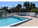 Relaxing community pool with patio furniture at 1051 Forrest Nelson Blvd # A-104, Port Charlotte, FL 33952