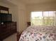 Main bedroom with king-size bed and access to balcony at 1246 Rio De Janeiro Ave # 503, Punta Gorda, FL 33983