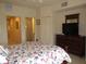 Main bedroom with a king-size bed, dresser, and en-suite bathroom at 1246 Rio De Janeiro Ave # 503, Punta Gorda, FL 33983