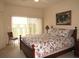 Main bedroom with a king-size bed and sliding glass doors to balcony at 1246 Rio De Janeiro Ave # 503, Punta Gorda, FL 33983