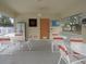 Community room with tables, chairs, and dartboard at 1246 Rio De Janeiro Ave # 503, Punta Gorda, FL 33983