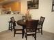 Dining area with a round table and four chairs at 1246 Rio De Janeiro Ave # 503, Punta Gorda, FL 33983