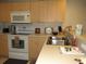 Well-equipped kitchen featuring ample cabinetry and modern appliances at 1246 Rio De Janeiro Ave # 503, Punta Gorda, FL 33983