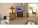 Living room with TV, sofa, and side tables at 1246 Rio De Janeiro Ave # 503, Punta Gorda, FL 33983