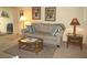 Living area featuring a sofa, coffee table, and lamps at 1246 Rio De Janeiro Ave # 503, Punta Gorda, FL 33983