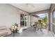 Relaxing screened porch with seating area at 1264 Shadow Ln, North Port, FL 34286