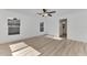 Bedroom with wood-look floors and access to bathroom at 1325 Goshen Rd, North Port, FL 34288