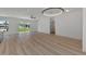 Bright living room featuring light wood flooring at 1325 Goshen Rd, North Port, FL 34288
