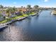 Waterfront property with private boat dock and lush landscaping at 1460 Raven Ct, Punta Gorda, FL 33950