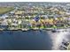 Aerial perspective showcasing a canal-front home with a private dock at 1460 Raven Ct, Punta Gorda, FL 33950
