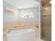 Spa-like bathroom with soaking tub, shower, and updated fixtures at 1460 Raven Ct, Punta Gorda, FL 33950