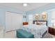 Guest bedroom with a queen-size bed and plenty of closet space at 1460 Raven Ct, Punta Gorda, FL 33950
