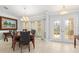 Bright dining room with large windows and a formal table setting at 1460 Raven Ct, Punta Gorda, FL 33950