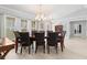 Elegant dining room with a large table and chandelier at 1460 Raven Ct, Punta Gorda, FL 33950