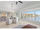 Bright dining room with water views and modern light fixture at 1460 Raven Ct, Punta Gorda, FL 33950