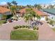 Single-story home with brick paver driveway and lush landscaping at 1460 Raven Ct, Punta Gorda, FL 33950