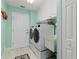 Convenient laundry room with washer, dryer, and utility sink at 1460 Raven Ct, Punta Gorda, FL 33950