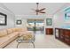 Living area featuring a sectional sofa and sliding doors leading to patio at 1460 Raven Ct, Punta Gorda, FL 33950