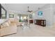 Spacious living room with water views and a comfortable sectional sofa at 1460 Raven Ct, Punta Gorda, FL 33950