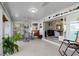 Spacious sunroom with tile floors, seating area, and views of the living room at 1460 Raven Ct, Punta Gorda, FL 33950