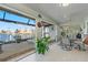 Bright sunroom with water views, seating area, and access to a hot tub at 1460 Raven Ct, Punta Gorda, FL 33950