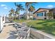 Peaceful waterfront view with seating area and lush landscaping at 1460 Raven Ct, Punta Gorda, FL 33950