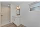 Clean bathroom with white vanity, shower, and wood-look floors at 1543 Gorham St, North Port, FL 34288
