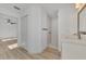 Bathroom with shower, vanity, and wood-look floors at 1543 Gorham St, North Port, FL 34288
